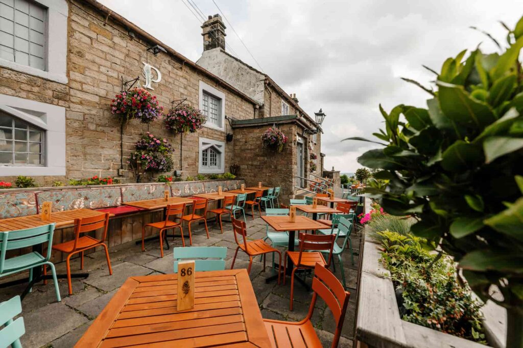 Outside seating and terrace at The Peacock at Owler Bar