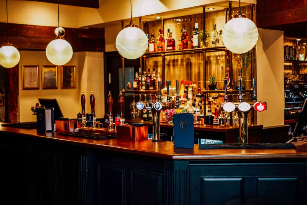The bar area and drinks at The Peacock at Owler Bar