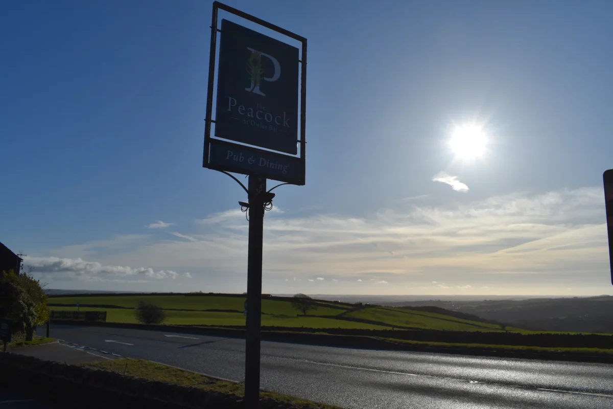 Peacock-OB-Outside-Sign-Sun