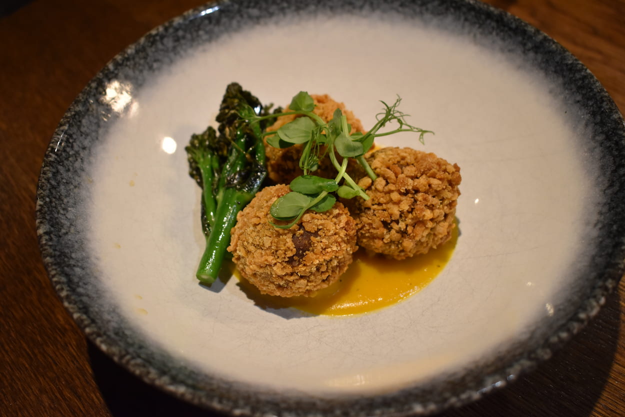 Wasabi duck bonbon with sweet potato purée and grilled broccoli