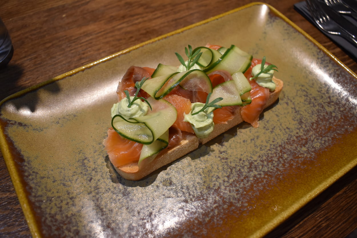 Citrus cured salmon with pickled cucumber ribbons, dill emulsion and toasted sourdough