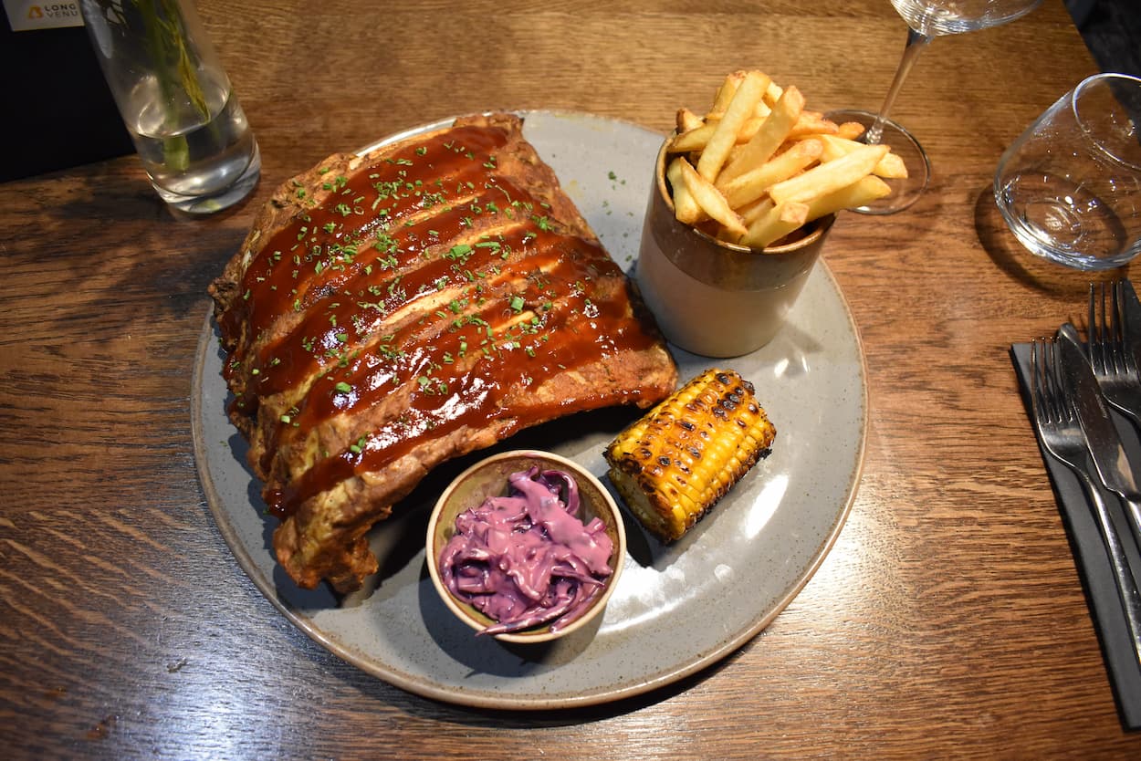 BBQ pork ribs with coleslaw, grilled corn and skinny fries